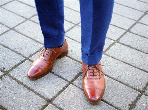 brown shoes with blue pants